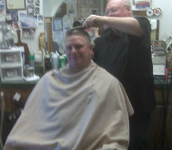 Brad gets a Texas hair-cut.