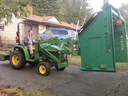 Bucket Tractor moving the PVG-12V soil screener